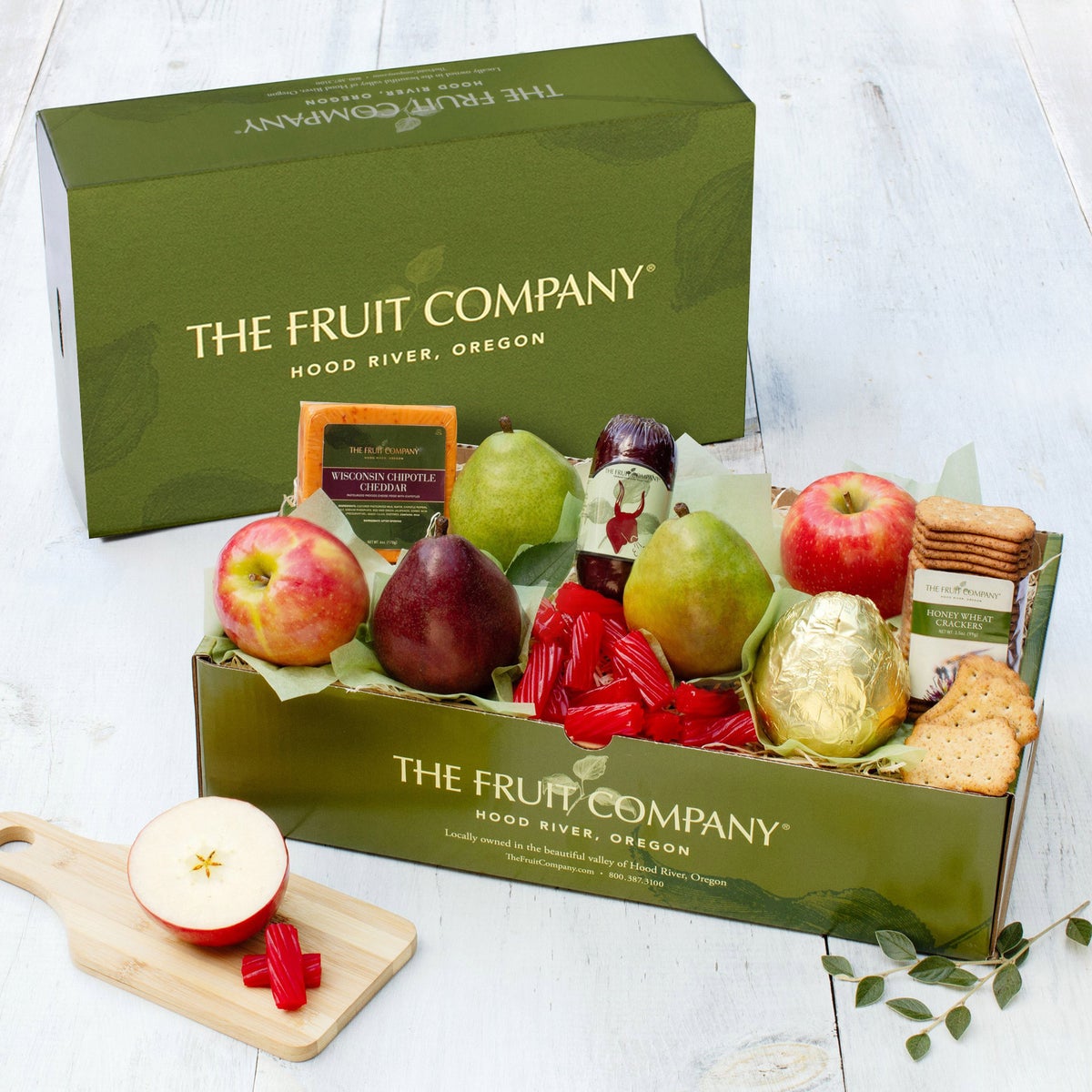 Covered Bridge fruit gift basket with assorted gourmet snacks