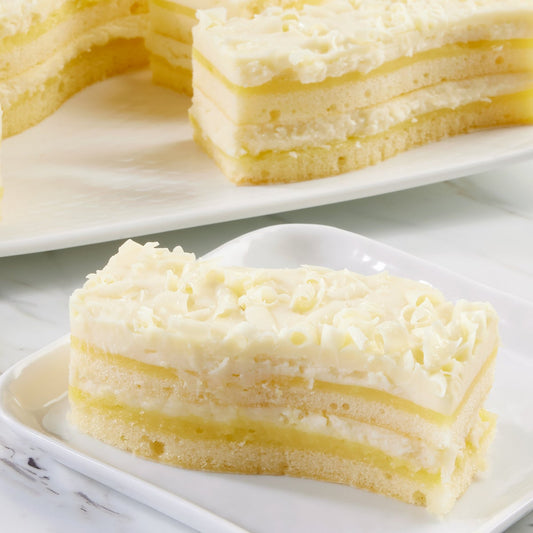 Pre-cut lemon dessert cake with white chocolate mousse