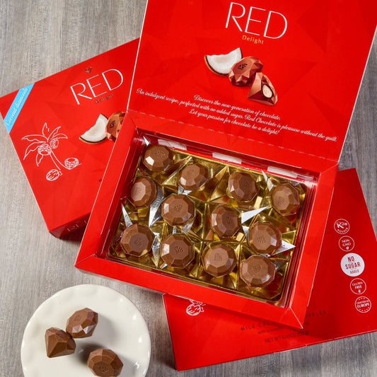 Boxed coconut truffles with milk chocolate coating