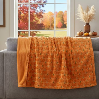 Halloween embroidered faux fur throw with pumpkin design