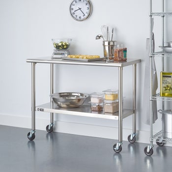 TRINITY stainless steel prep table with adjustable shelf and casters