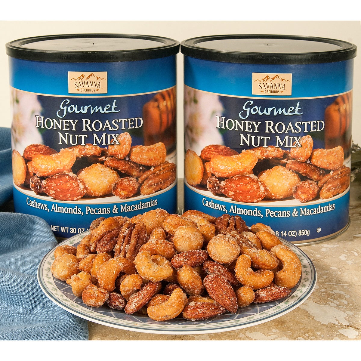 Resealable cans of honey roasted cashews almonds pecans and macadamias