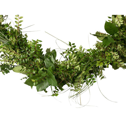 Fresh assorted greens garland close-up