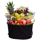 Gift fruit basket with pears apples pineapple salami and gouda