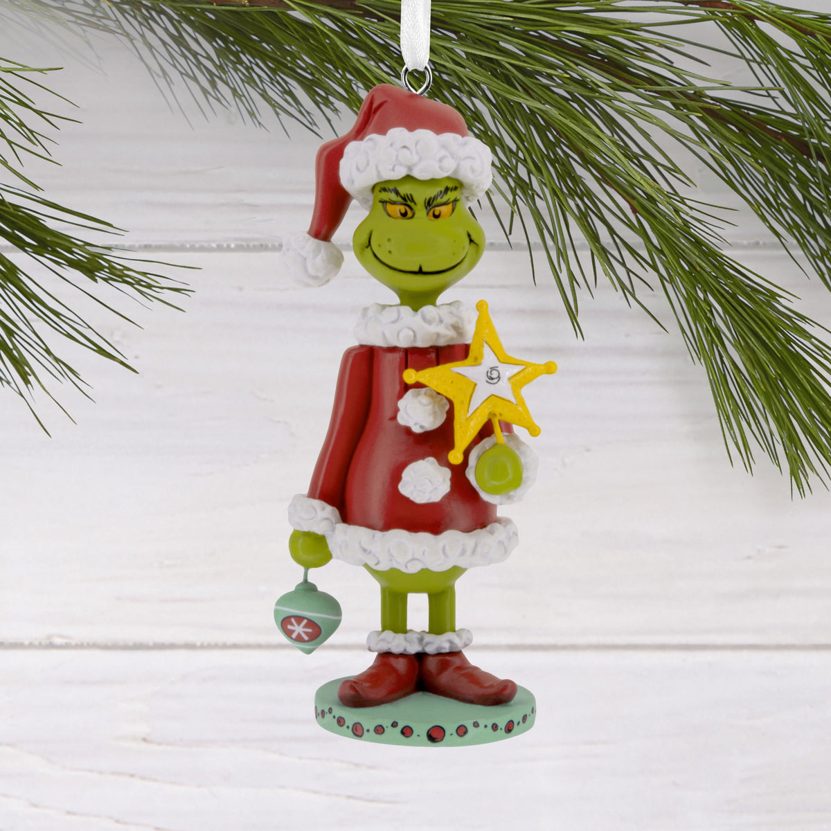 Grinch nutcracker ornament in a homemade Santa suit