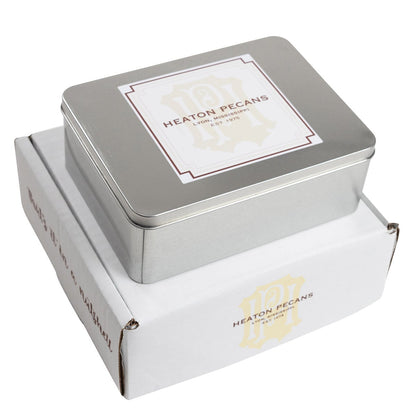 Milk chocolate pecans in square metal tin