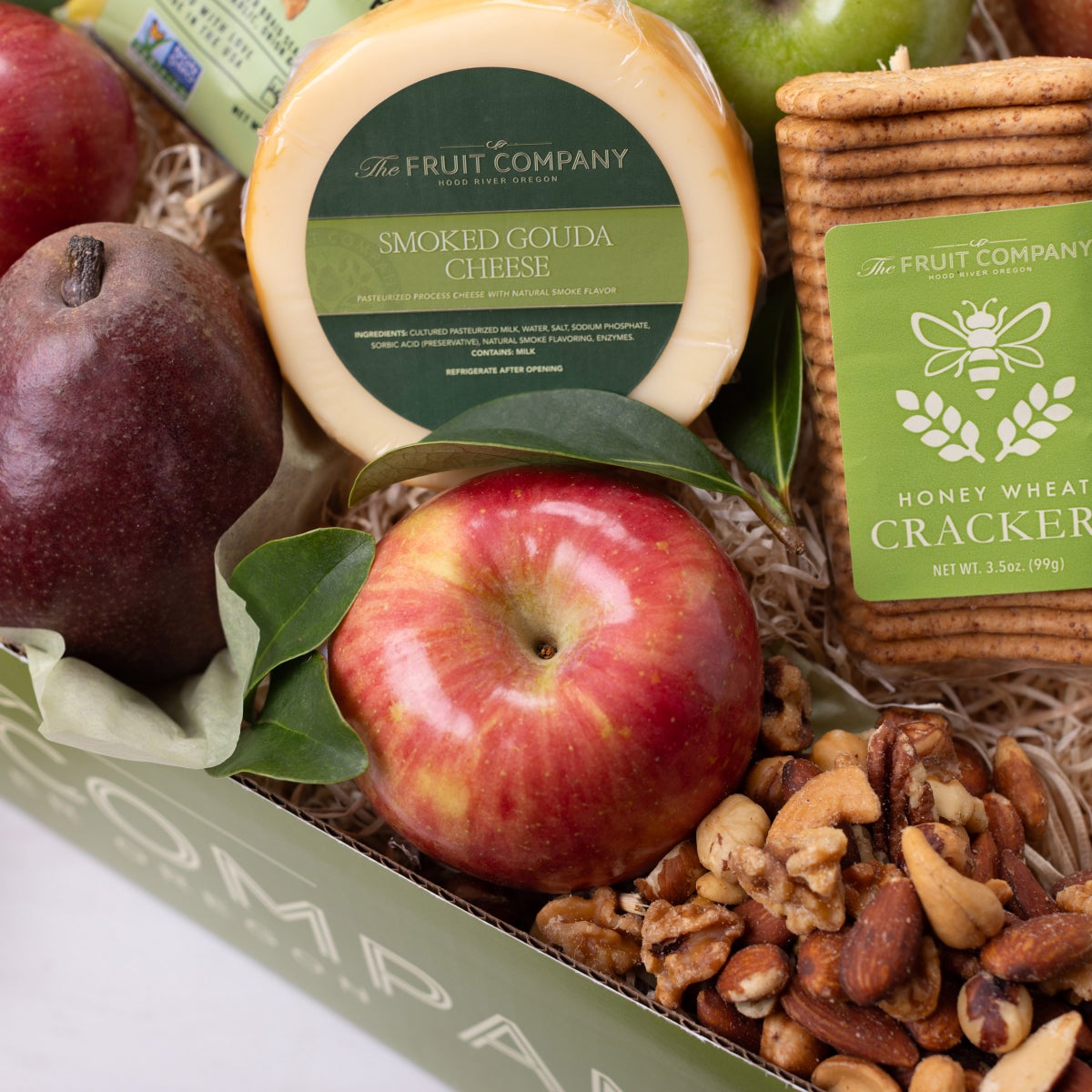 Assorted fruit and cheese gift box arrangement