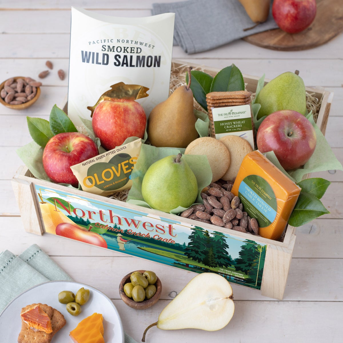 Snack crate with apples pears salmon cheese and crackers
