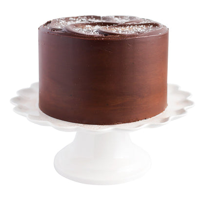 Round celebration cake topped with fleur de sel