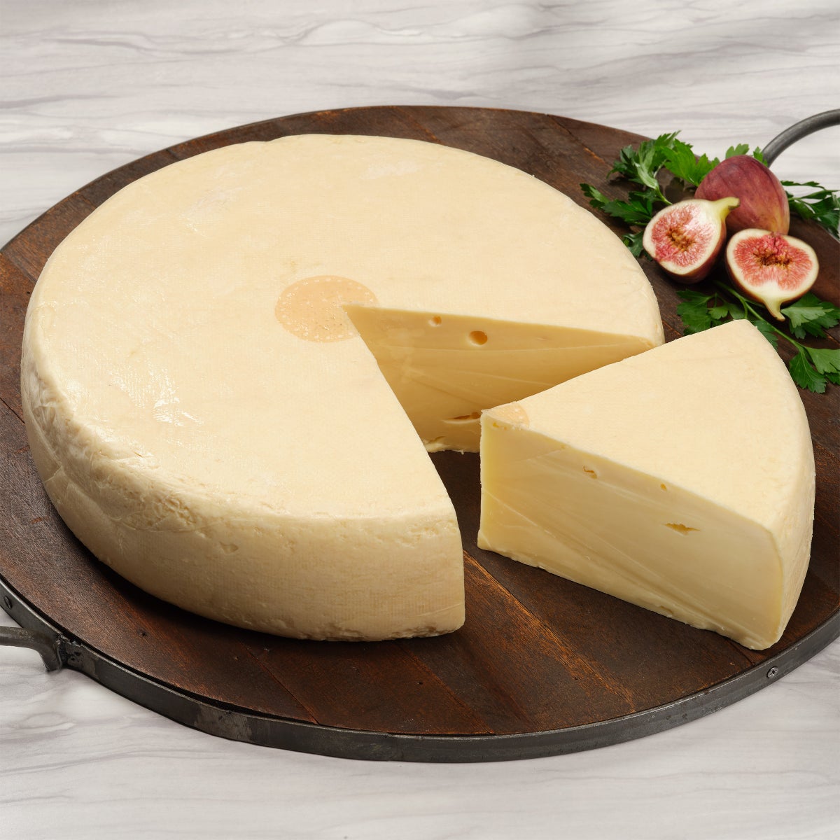 Swiss raclette cheese wheel made from cow’s milk