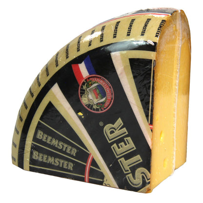 Approximate 6 lb quarter wheel of Beemster cheese