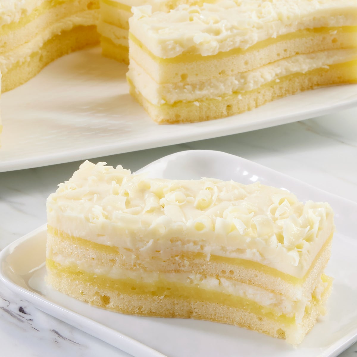 Pre-cut lemon dessert cake with white chocolate mousse