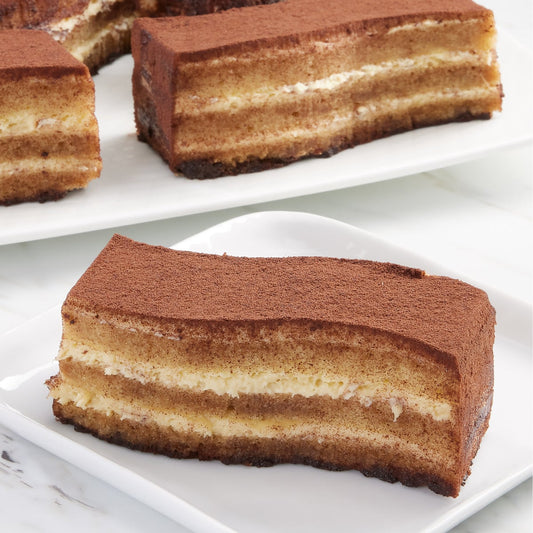 Pre-cut tiramisu dessert cake with coffee-soaked layers
