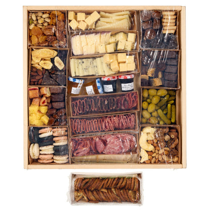 Sweet and savory snack board with crackers and fruit