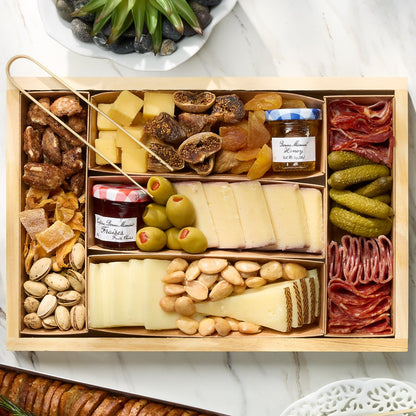 Premium snack board with crackers, fruit, and jams