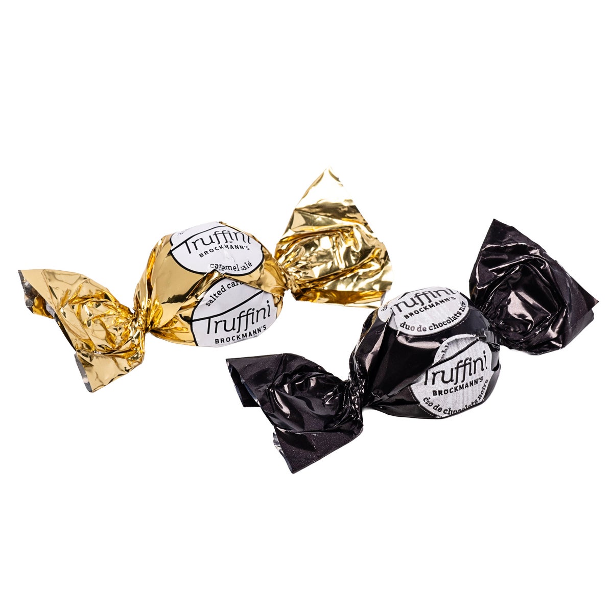 Salted caramel milk and dark chocolate truffles in gold foil