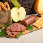 Woven hamper gift basket with savory snacks and apples