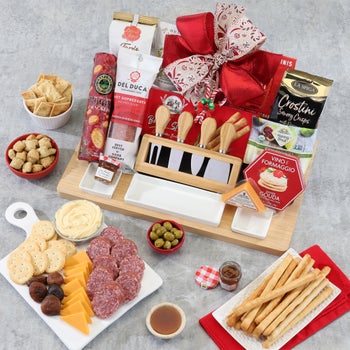 Holiday charcuterie board with salami cheese spread crisps and figs