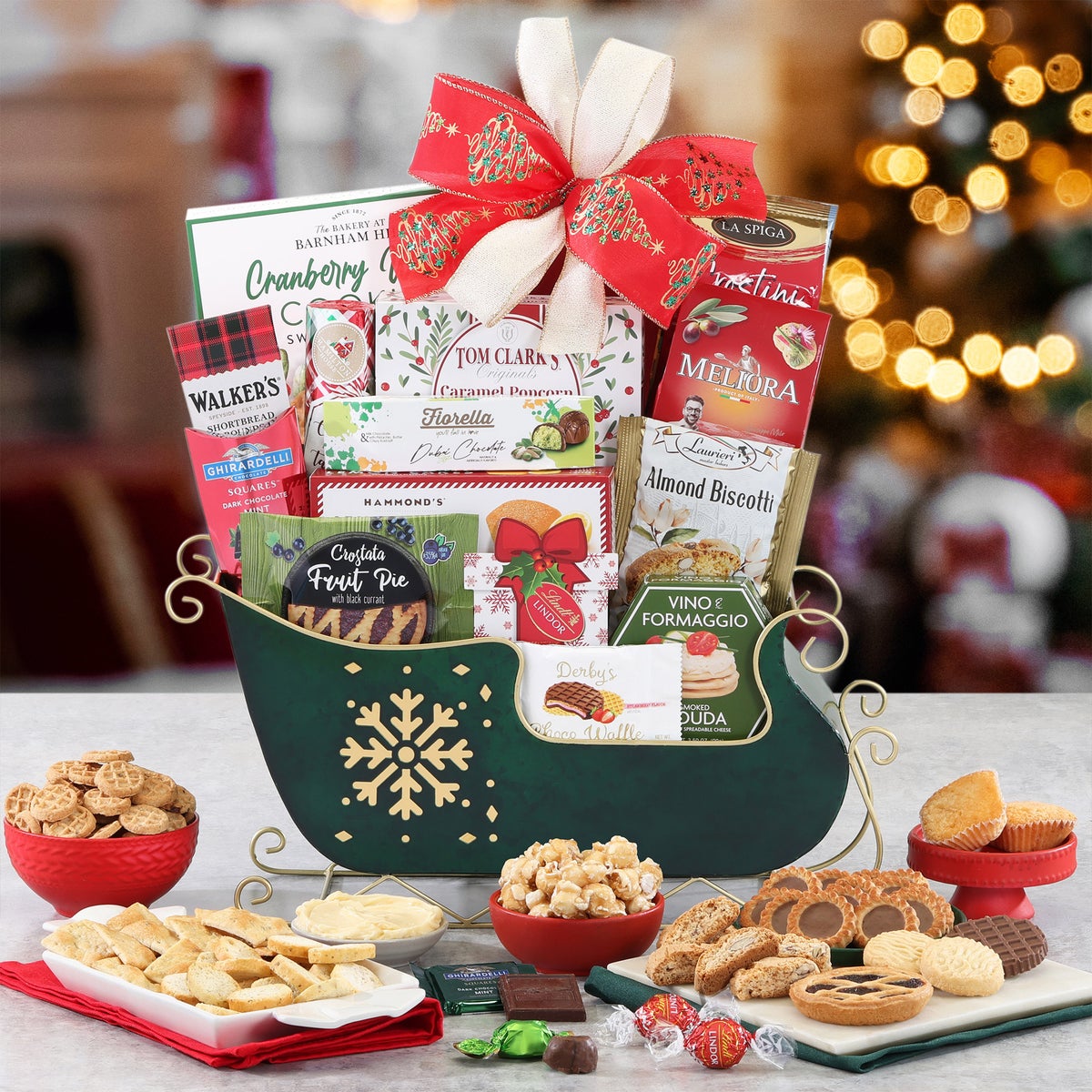 Festive gourmet holiday sleigh gift basket with snacks