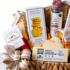 Gourmet gathering basket with savory snacks and sweet treats