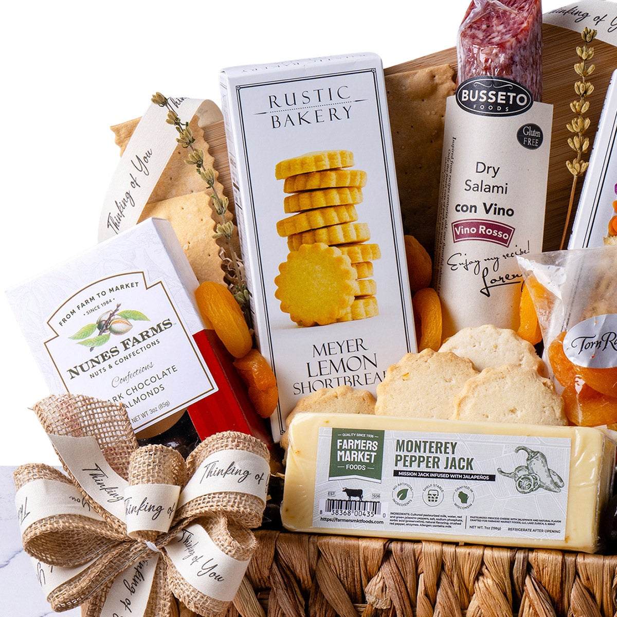 Gourmet gathering basket with savory snacks and sweet treats