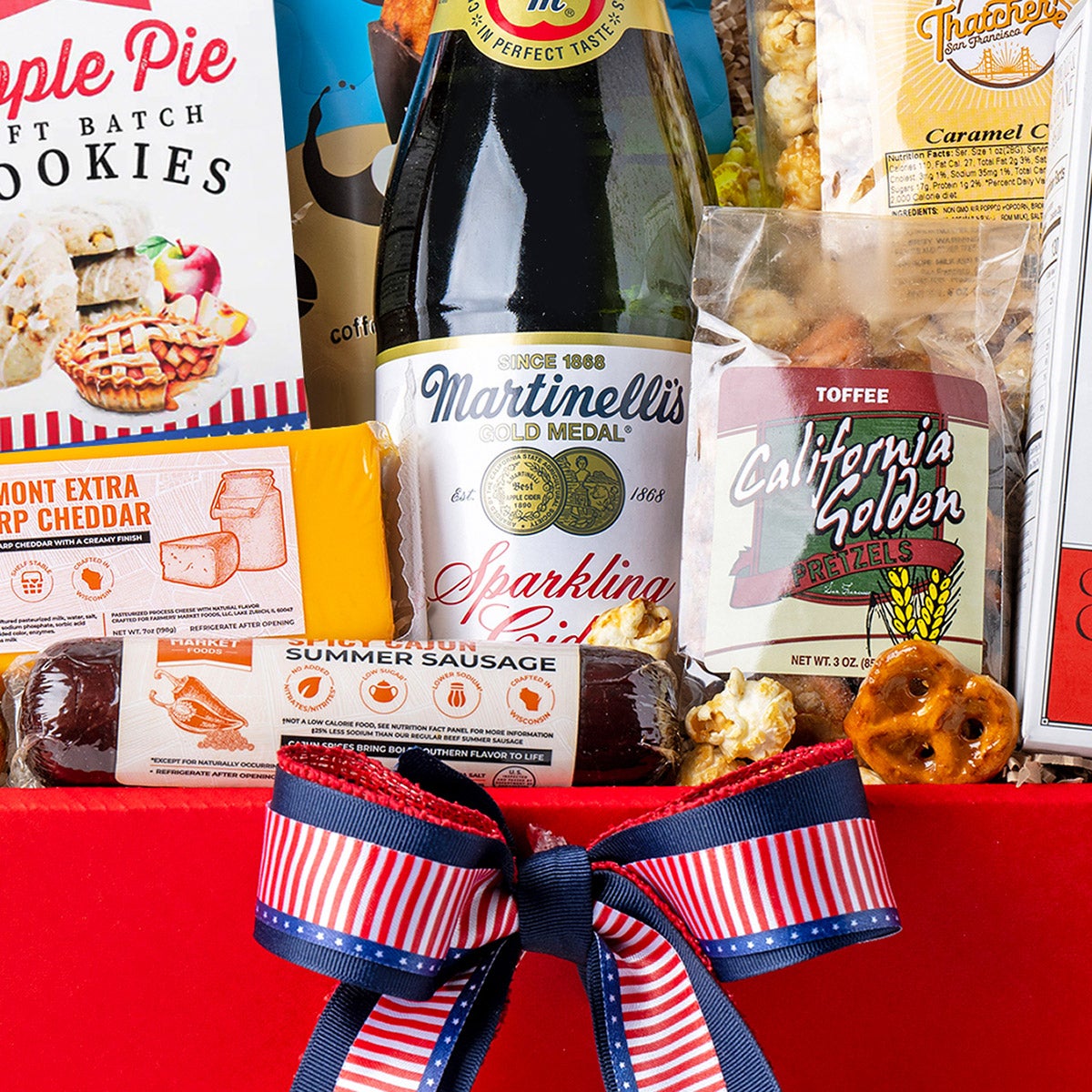 Picnic gift box with sparkling apple cider and snacks