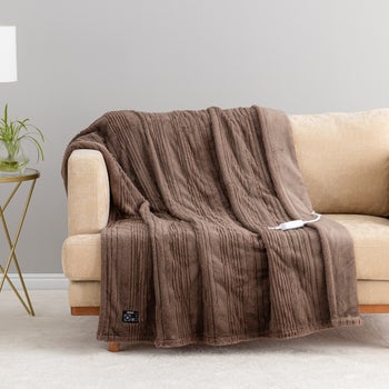 Reversible ivory heated throw for sofa