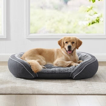 Orthopedic pet bed with curved bolsters and anti-slip bottom