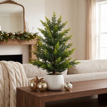 Nearly Natural faux 24 inch tabletop cedar tree in decorative pot