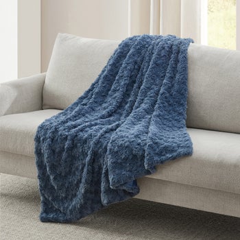 Casual Living ivory faux fur throw blanket with sculpted rosette texture