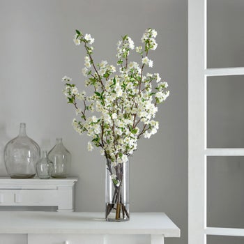 Faux 44 inch white cherry blossom arrangement in glass vase