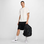 Black Nike backpack with front bungee storage