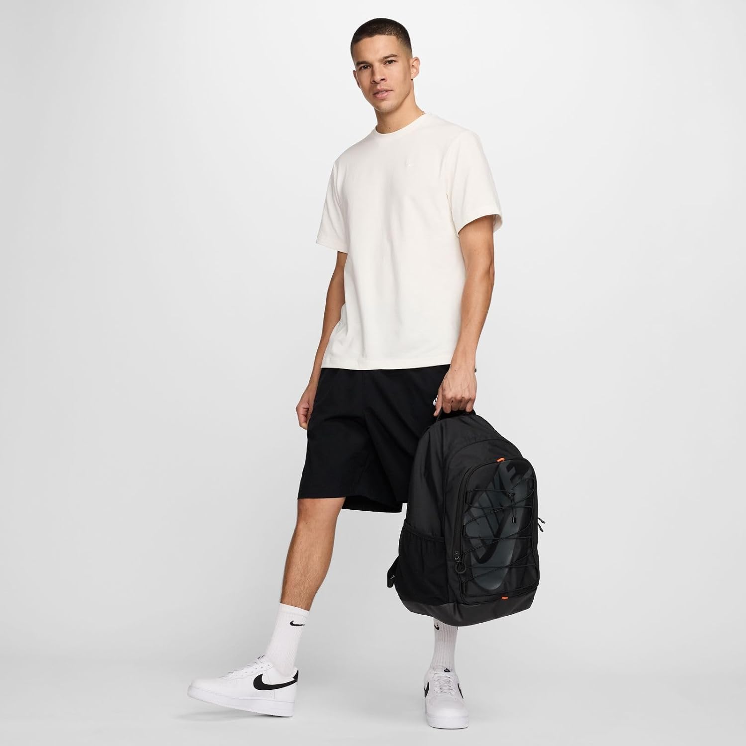Black Nike backpack with front bungee storage