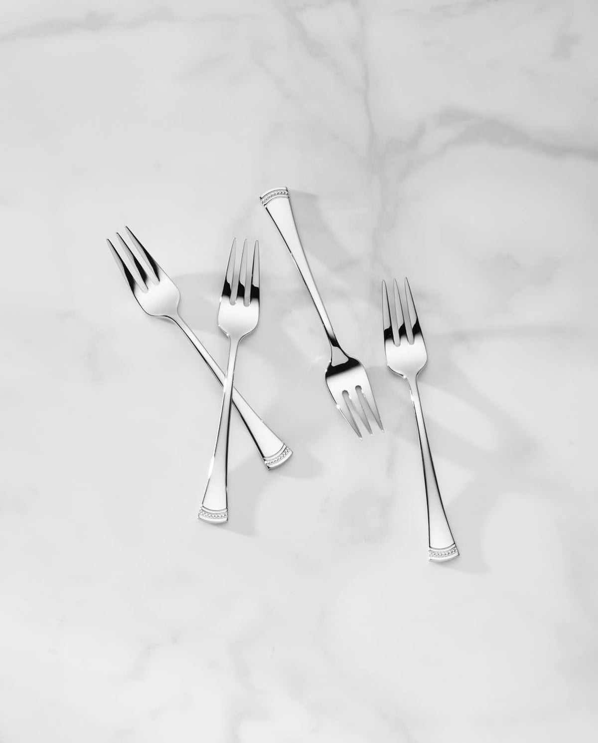 Portola flatware with flared handles and beaded detail