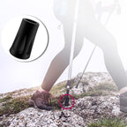 Shock-absorbing walking pole tips for hard surfaces