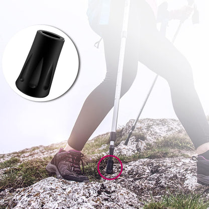 Shock-absorbing walking pole tips for hard surfaces