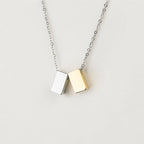 Gold- and silver-tone cube jewelry by Anavia