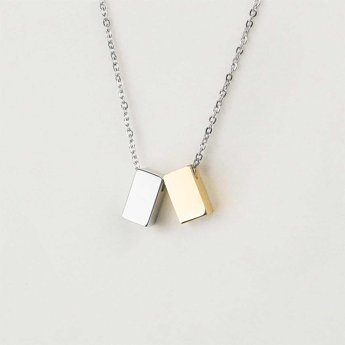 Gold- and silver-tone cube jewelry by Anavia