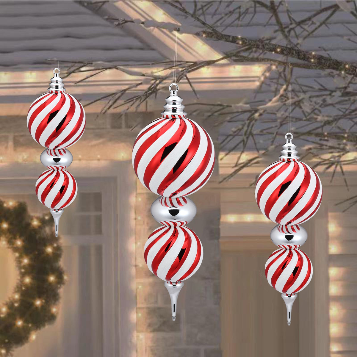 23-inch shatterproof Christmas finial with swirling red and white stripes