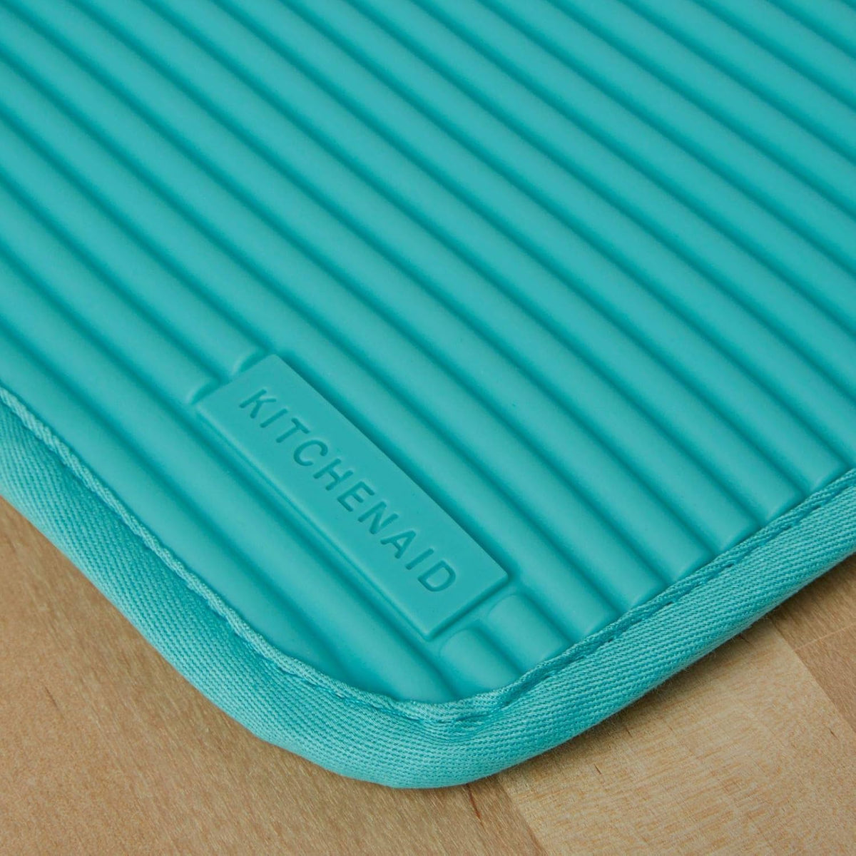 Ribbed soft silicone pot holder with cotton backing