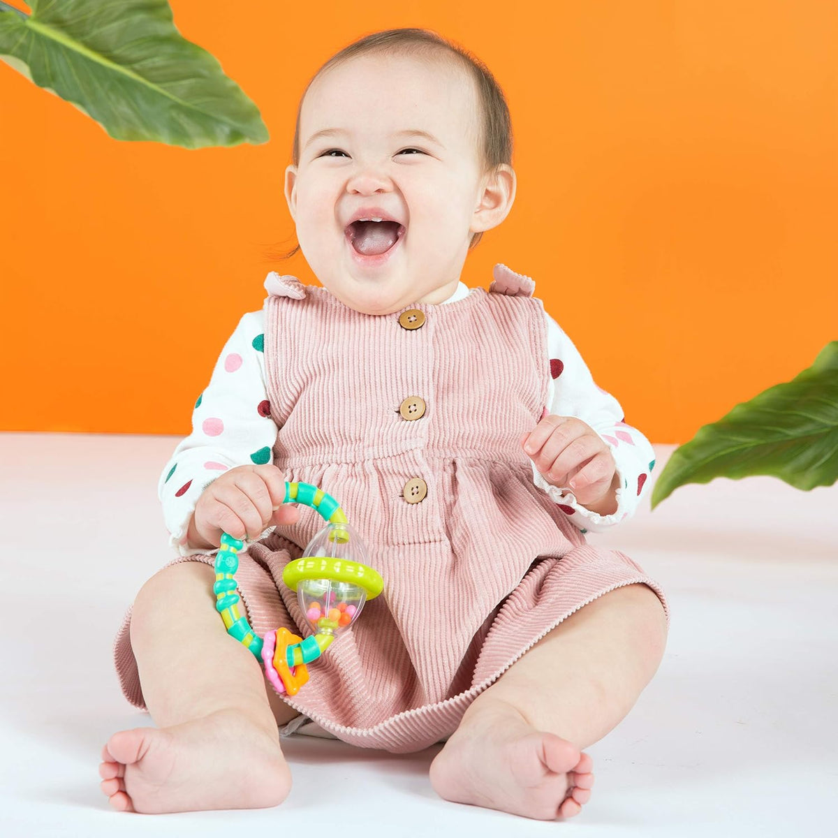 Textured baby teethers and Oball rattles for little hands