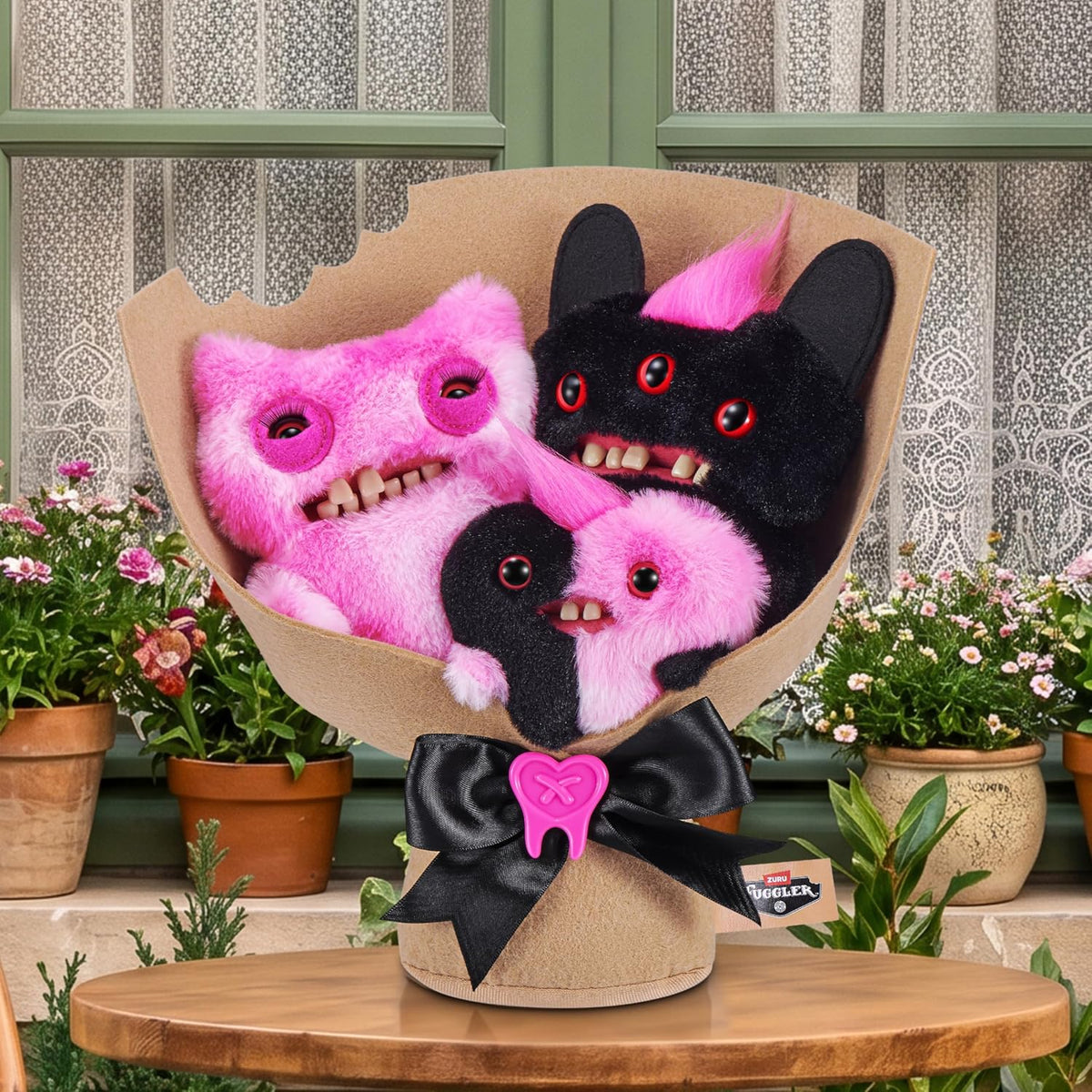 Fuggler plush misfits bundled in craft-paper bouquet wrapping