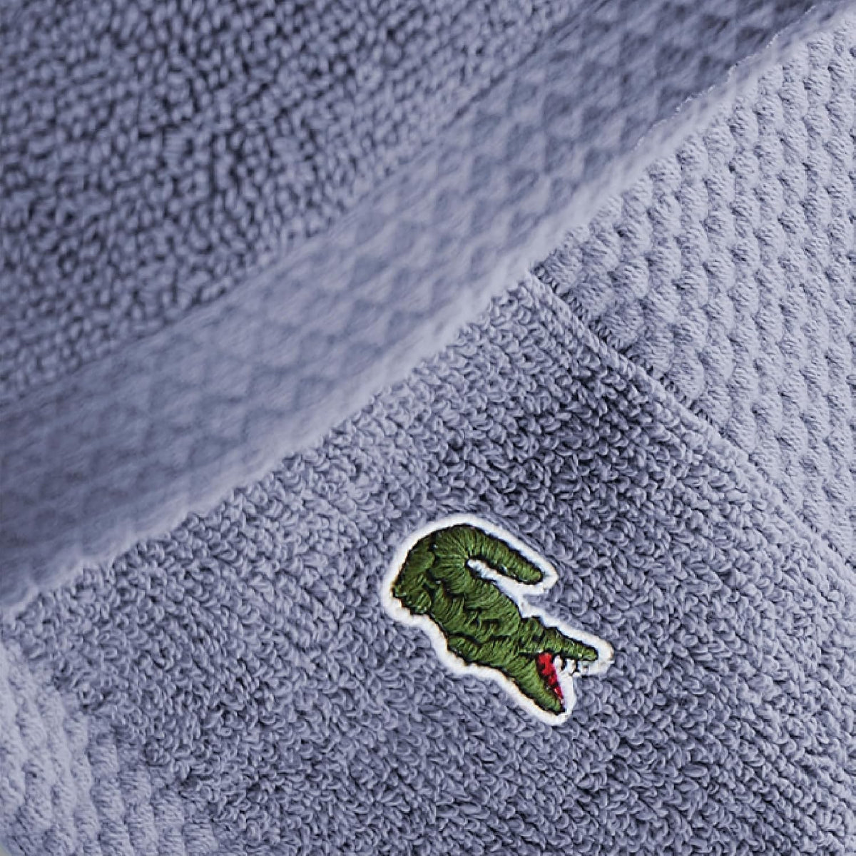 Soft blue Lacoste Heritage bath towel with pique border