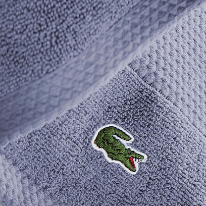 Soft blue Lacoste Heritage bath towel with pique border
