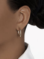 Hollow yellow gold hoop earrings measuring 3 mm x 25 mm