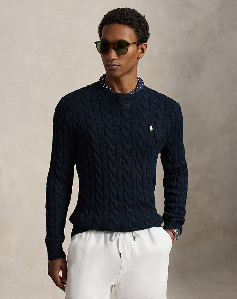 Rib-knit hem on cable-knit cotton sweater