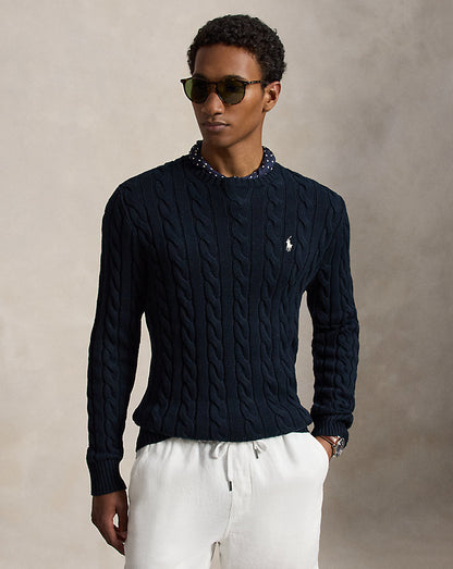 Rib-knit hem on cable-knit cotton sweater